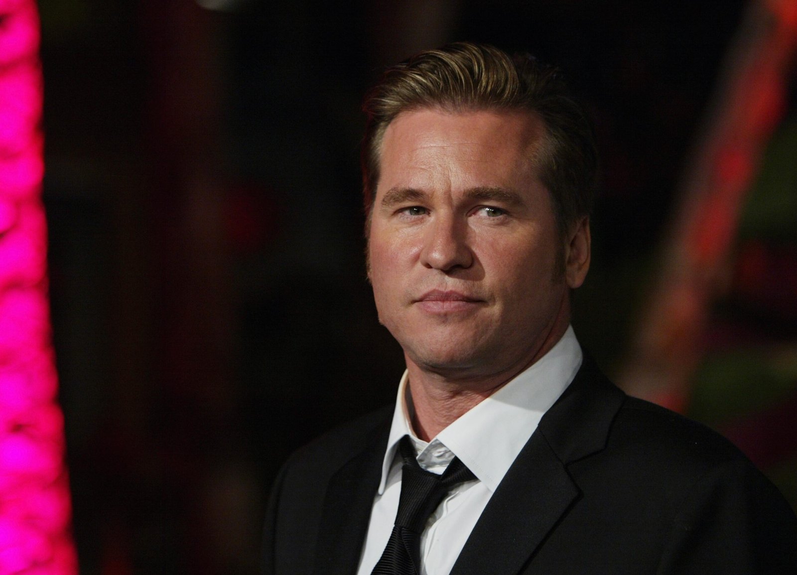iturn0image0turn0image1turn0image4turn0image8Val Kilmer's Ongoing Journey Health Battles and Hollywood Resilience March 30, 2025 LOS ANGELES, CA — Renowned actor Val Kilmer, celebrated for his roles in iconic films such as Top Gun, The Doors, and Batman Forever, continues to navigate the complexities of his health challenges while maintaining a presence in the entertainment industry. ### Health Struggles and Resilience In 2015, Kilmer was diagnosed with throat cancer, a condition he initially kept private. The diagnosis led to a tracheostomy, affecting his vocal abilities and necessitating a pause in his acting career. Despite these challenges, Kilmer has demonstrated remarkable resilience. As of February 2025, reports indicate that he remains in remission, focusing on his health and well-being. citeturn0search4 ### Return to the Silver Screen Kilmer made a notable return to cinema with his reprisal of the character Tom Iceman Kazansky in the 2022 blockbuster Top Gun Maverick. His appearance was met with critical acclaim and emotional responses from audiences and co-stars alike. Tom Cruise, Kilmer's longtime colleague, expressed profound emotion during their scenes together, stating, I was crying. I got emotional. citeturn0search2 ### Reflections on Past Roles Reflecting on his illustrious career, Kilmer has shared insights into his experiences with various roles. Notably, he revealed that he initially attempted to sabotage his audition for the original Top Gun film, lacking interest in the project. Despite his efforts, director Tony Scott cast him, leading to one of Kilmer's most memorable performances. citeturn0search1 ### Personal Life and Relationships In November 2024, singer and actress Cher disclosed details about her past relationship with Kilmer, describing him as one of the few men who ended their romantic involvement. Cher reminisced about their deep connection and mutual respect, highlighting the unique bond they shared during their time together. citeturn0news9 ### Current Endeavors and Outlook At 65, Kilmer remains a figure of inspiration, balancing his health journey with creative pursuits. He continues to engage with fans and the industry, embodying resilience and dedication. His story serves as a testament to the enduring spirit of an artist facing life's unpredictable challenges. Suggested Featured Photos 1. Val Kilmer at a recent public appearance An image capturing Kilmer's current presence in the public eye. 2. Still from 'Top Gun Maverick' A scene featuring Kilmer reprising his role as Iceman alongside Tom Cruise. 3. Archival photo from 'Top Gun' (1986) A nostalgic look at Kilmer's original portrayal of Iceman. These visuals encapsulate the journey of Val Kilmer, highlighting his enduring impact on Hollywood and his personal resilience.